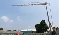 Potain HUP 32-27 self-erecting crane standing tall for fast setup and repeat lifts.